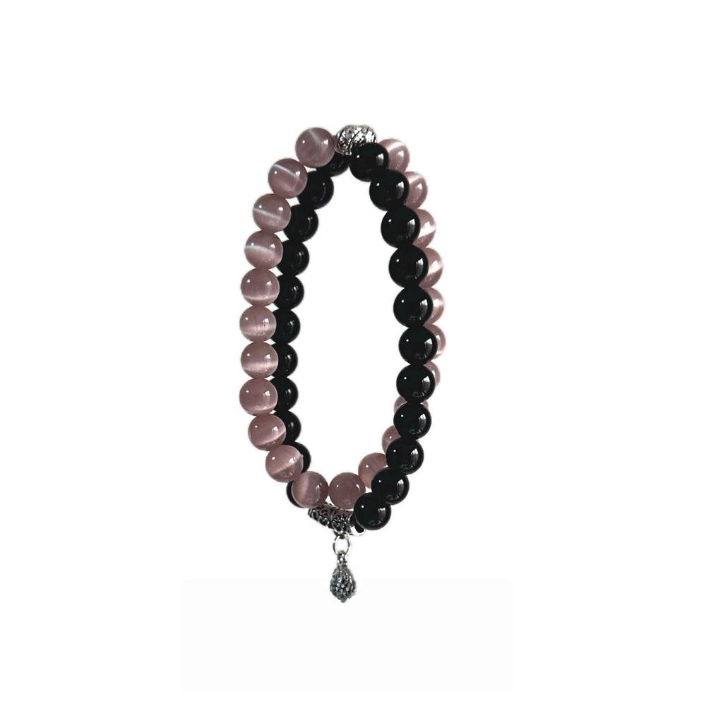 Black obsidian bracelet with pink cat eye crystal, designed to protect energy and attract love
