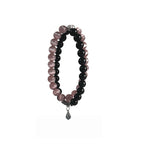 Black obsidian bracelet with pink cat eye crystal, designed to protect energy and attract love