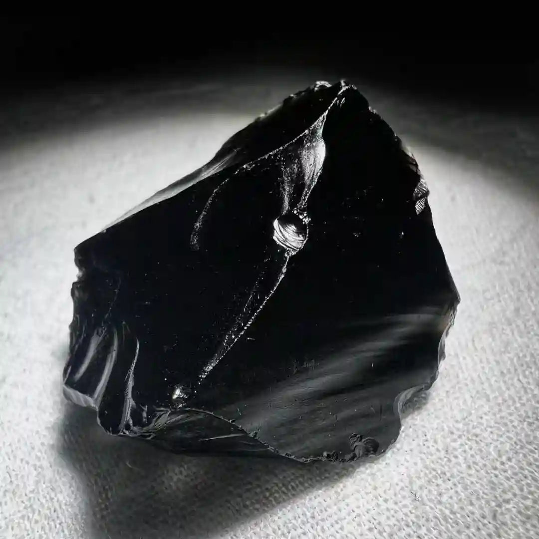 Black obsidian rough stones with energy cleansing and root chakra meaning