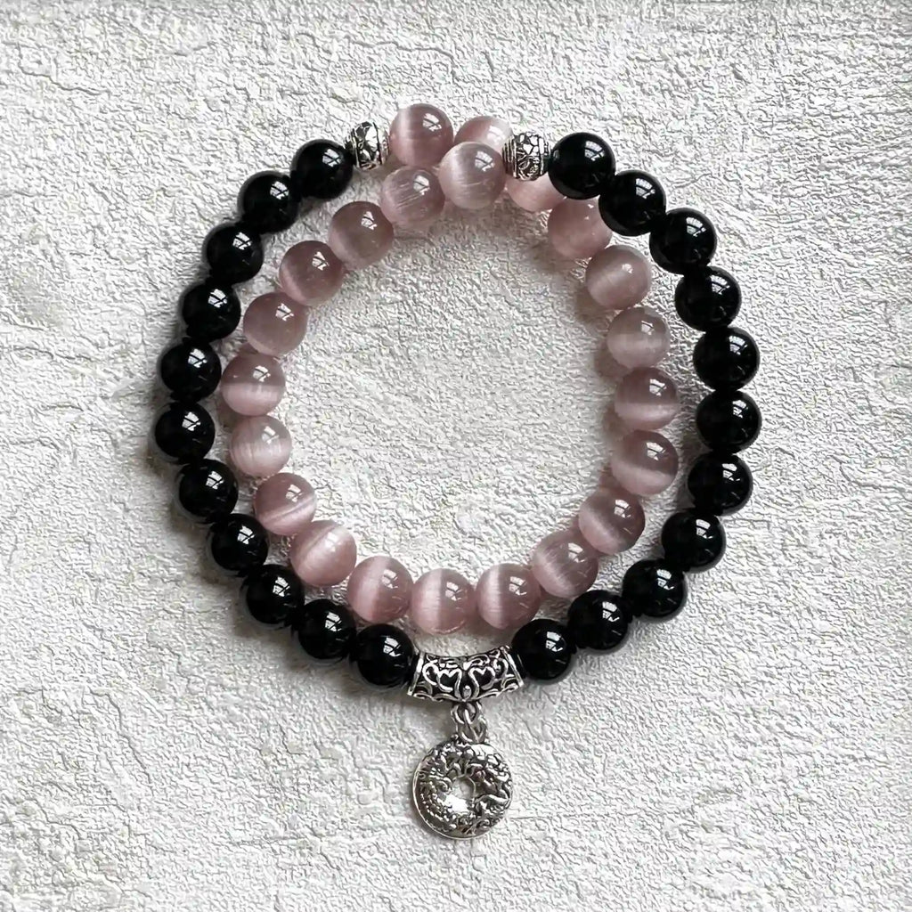 Bracelet featuring black obsidian stones and pink cats eye crystal for protection