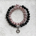 Bracelet featuring black obsidian stones and pink cats eye crystal for protection