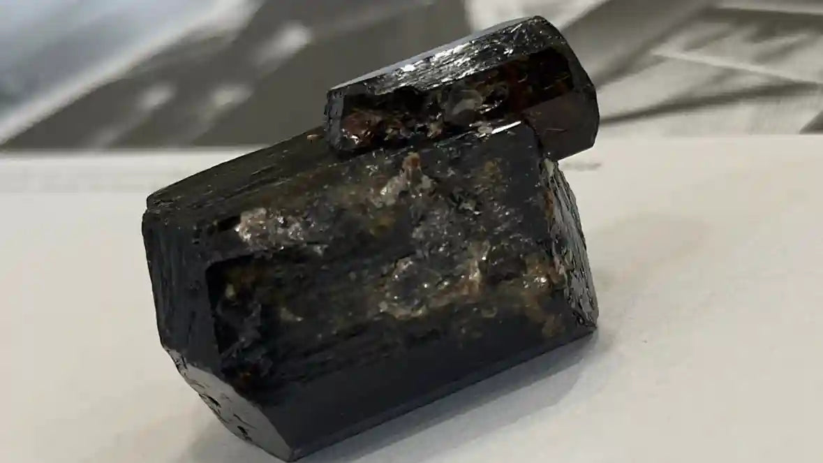 Black tourmaline crystal for protection with grounding symbolism