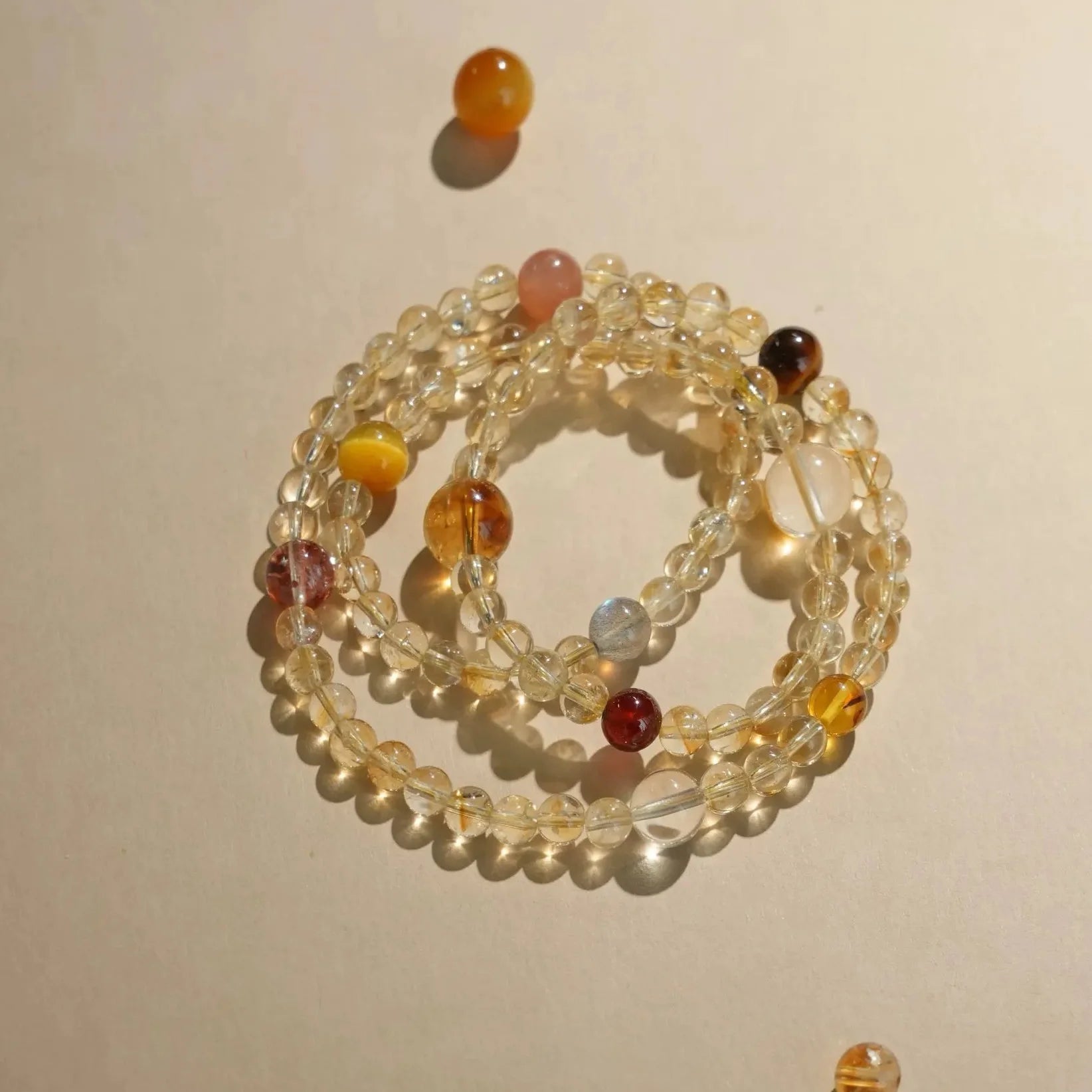 Citrine charm bracelet with gold tower beads that brings wealth