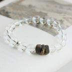 Clear quartz bead bracelet with natural agarwood, designed to cleanse energy and support inner calm