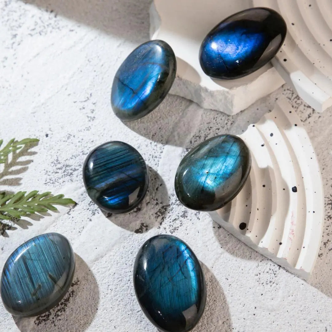 Labradorite crystal featuring a natural gray surface with beautiful blue light reflections