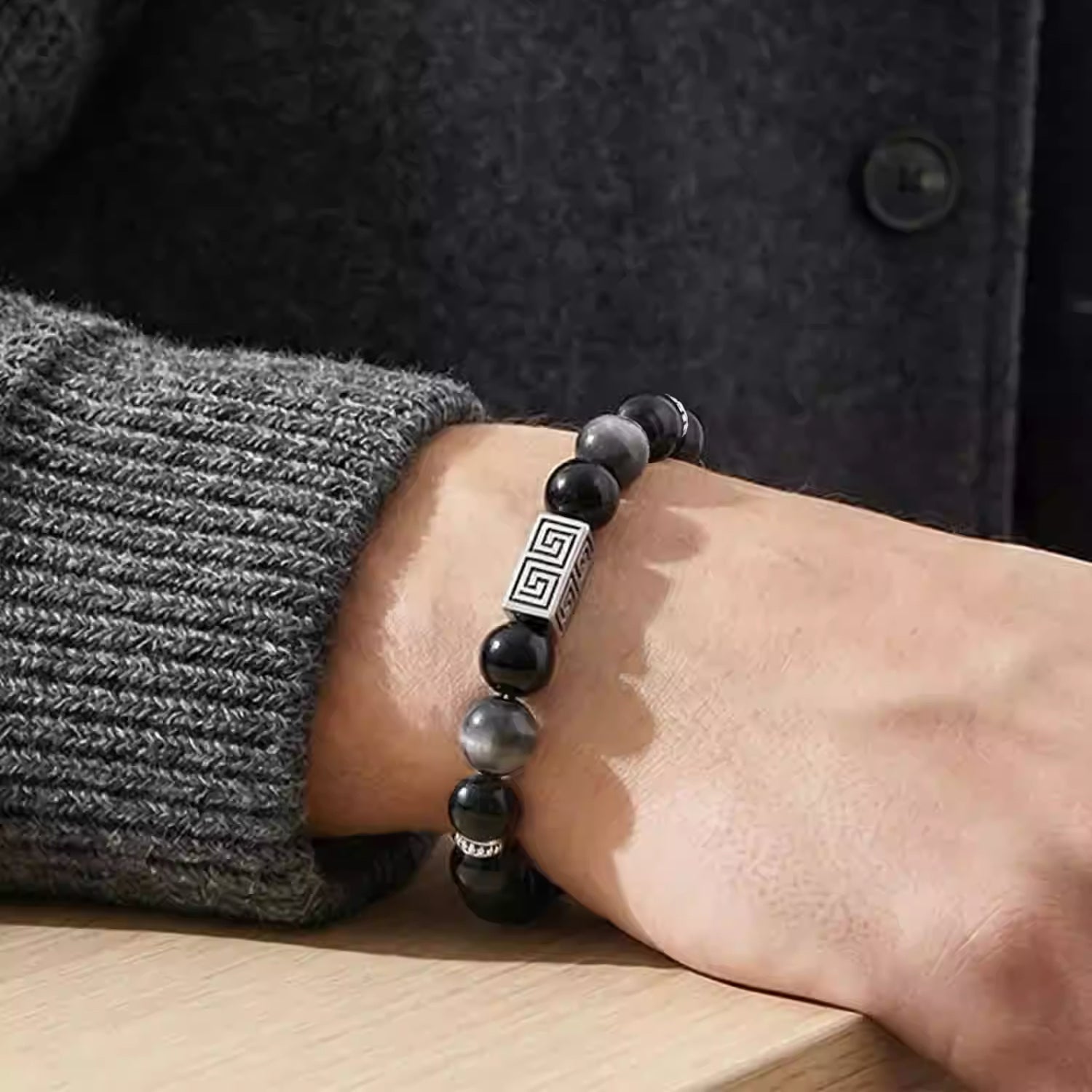 Silver obsidian bracelet for men, symbolizing protection and strength