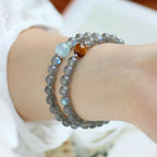 Moonstone crystal bracelet with aquamarine bead, highlighting serene energy, mindfulness, and intuitive guidance