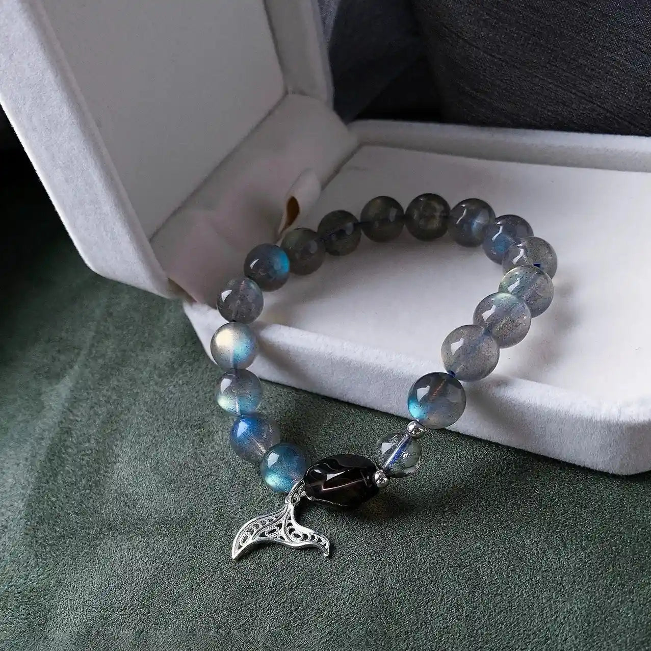 Moonstone gemstone bracelet with mermaid tail charm, designed to awaken intuition and connect with ocean energ