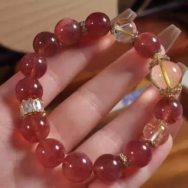 Strawberry crystal bracelet with natural pink gemstone beads and a delicate jewelry design