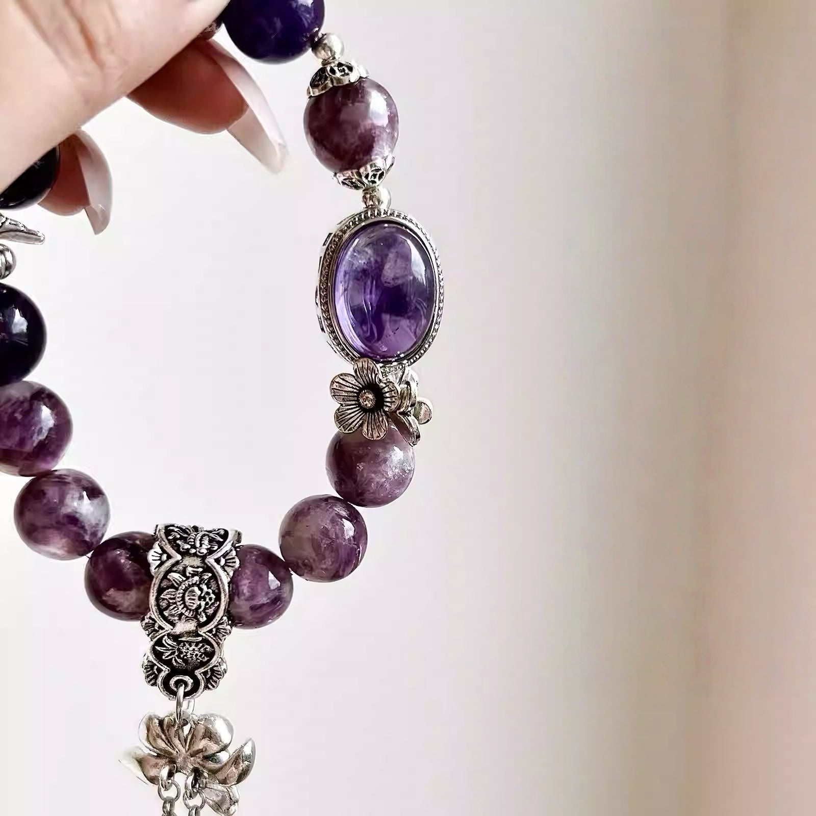 Women amethyst chakra bracelet featuring purple crystal stones and natural gemstones