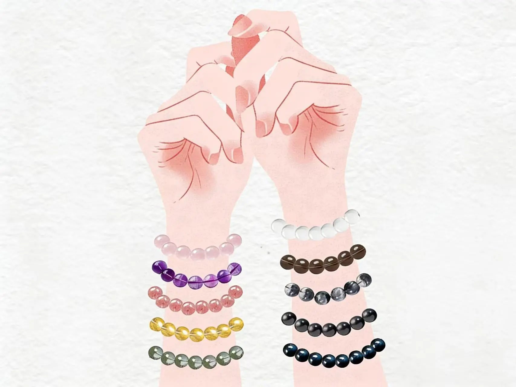 Two hands wearing different crystal bracelets, showcasing styling options for layering and intention-setting. Visual guide for our blog on how to wear healing crystals