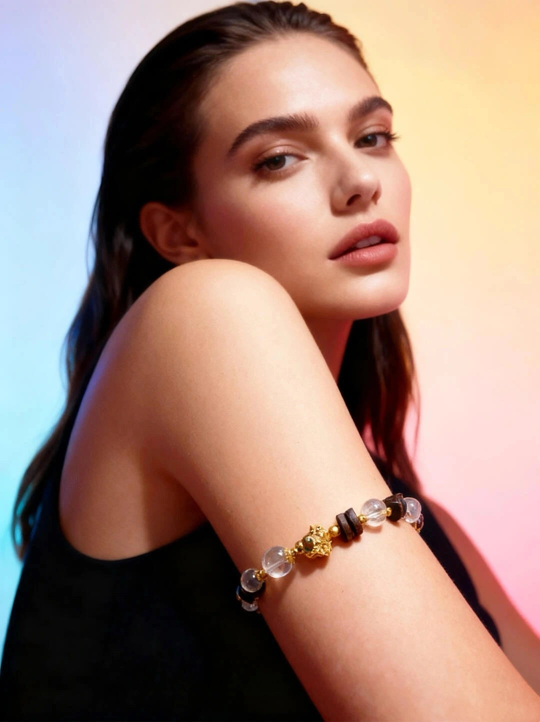 Female model wearing a crystal bracelet to enhance energy, balance chakras, and promote spiritual well-being