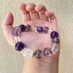 Close-up of amethyst and clear quartz bracelet, promoting mindfulness, intuition, and inner calm.