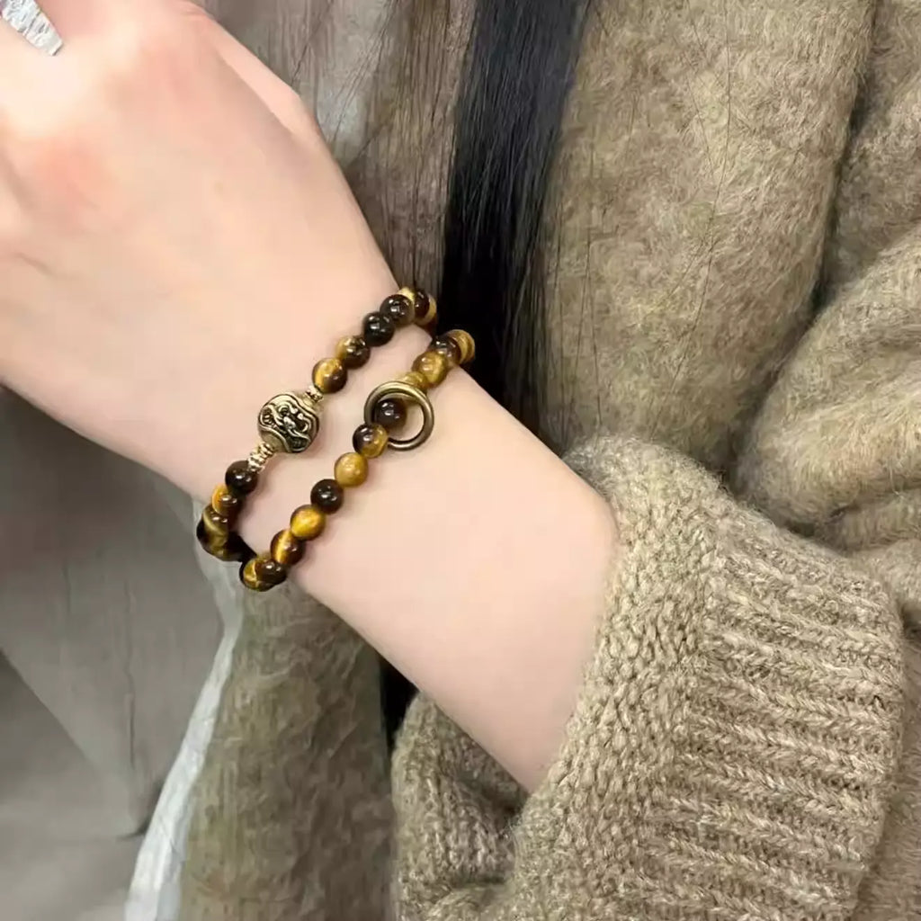 Model wearing Chinese vintage tiger eye bracelet for protection, confidence, and grounding energy – traditional crystal jewelry.
