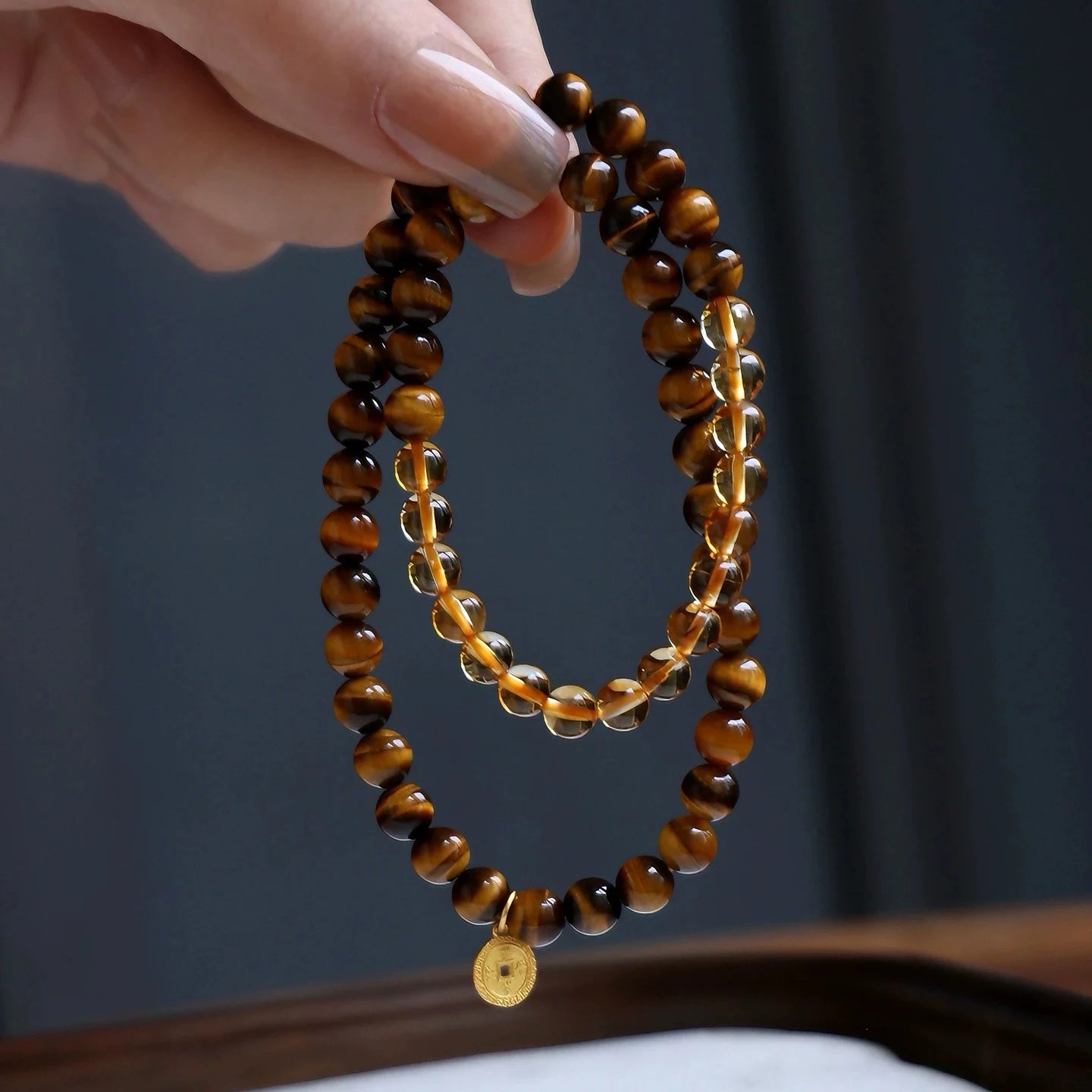 Double wrap citrine and tiger eye bracelet with coin charm for wealth, power, and abundance – natural crystal bracelet for prosperity.