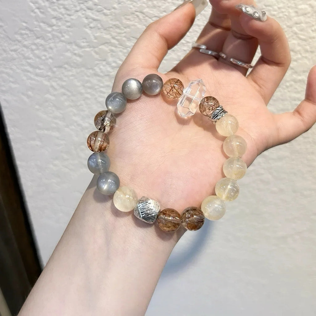 Citrine flower, moonstone, and gold obsidian bracelet, a spiritual accessory for manifesting wealth and safeguarding energy.