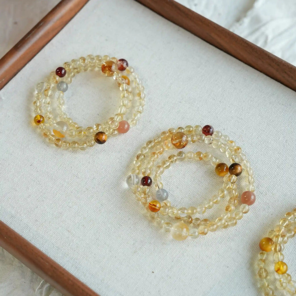 Styled multi wrap citrine crystal bracelet with gold accents, perfect for layering as energy bracelet accessory.