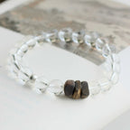 Elegant white quartz bracelet with natural agarwood, designed to cleanse energy and support inner calm.