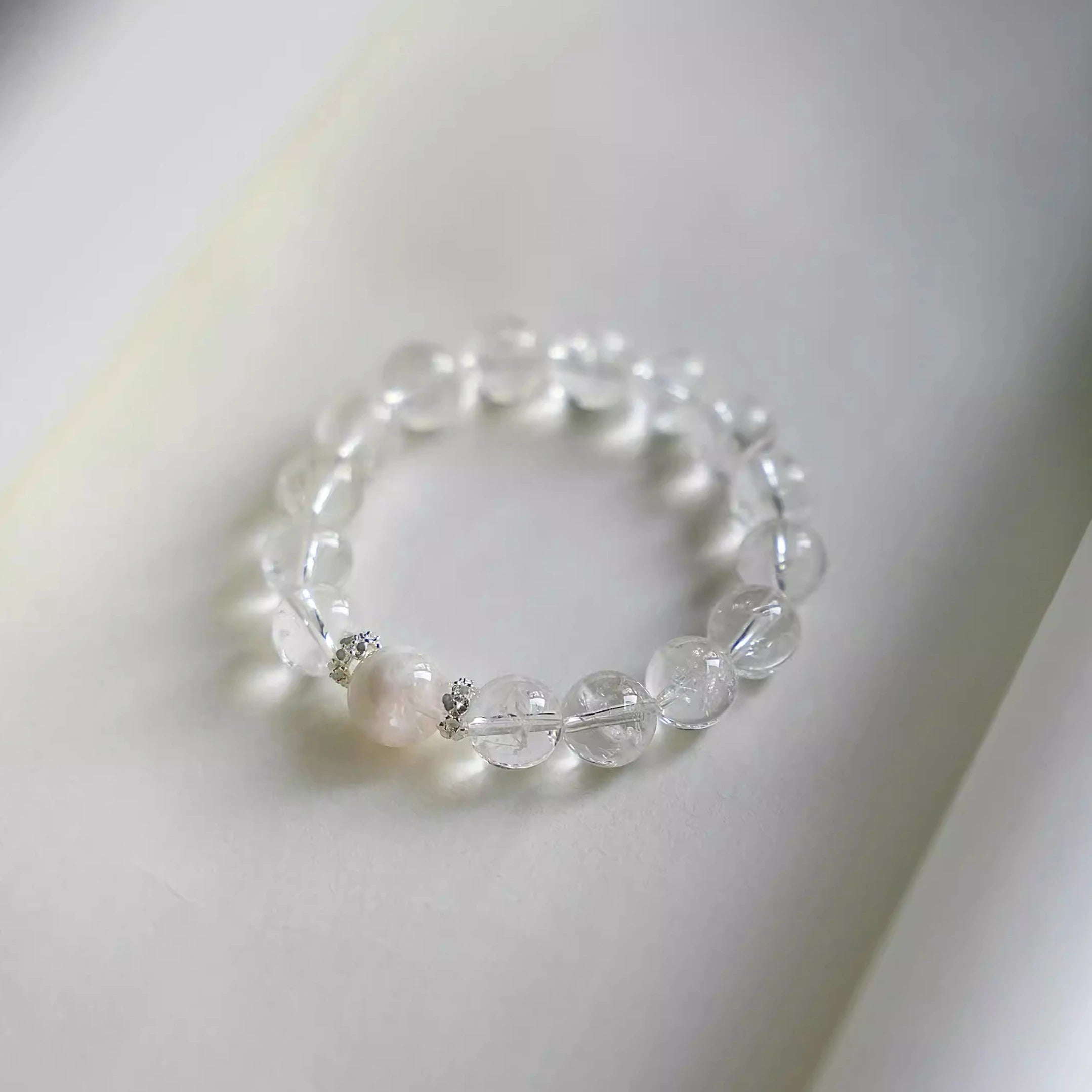 Elegant clear quartz bracelet for calm and healing energy – designer crystal jewelry for mindfulness and spiritual wellness.