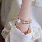 Woman wearing designer clear quartz bracelet for healing, calm, and positive energy – stylish crystal jewelry for spiritual balance.