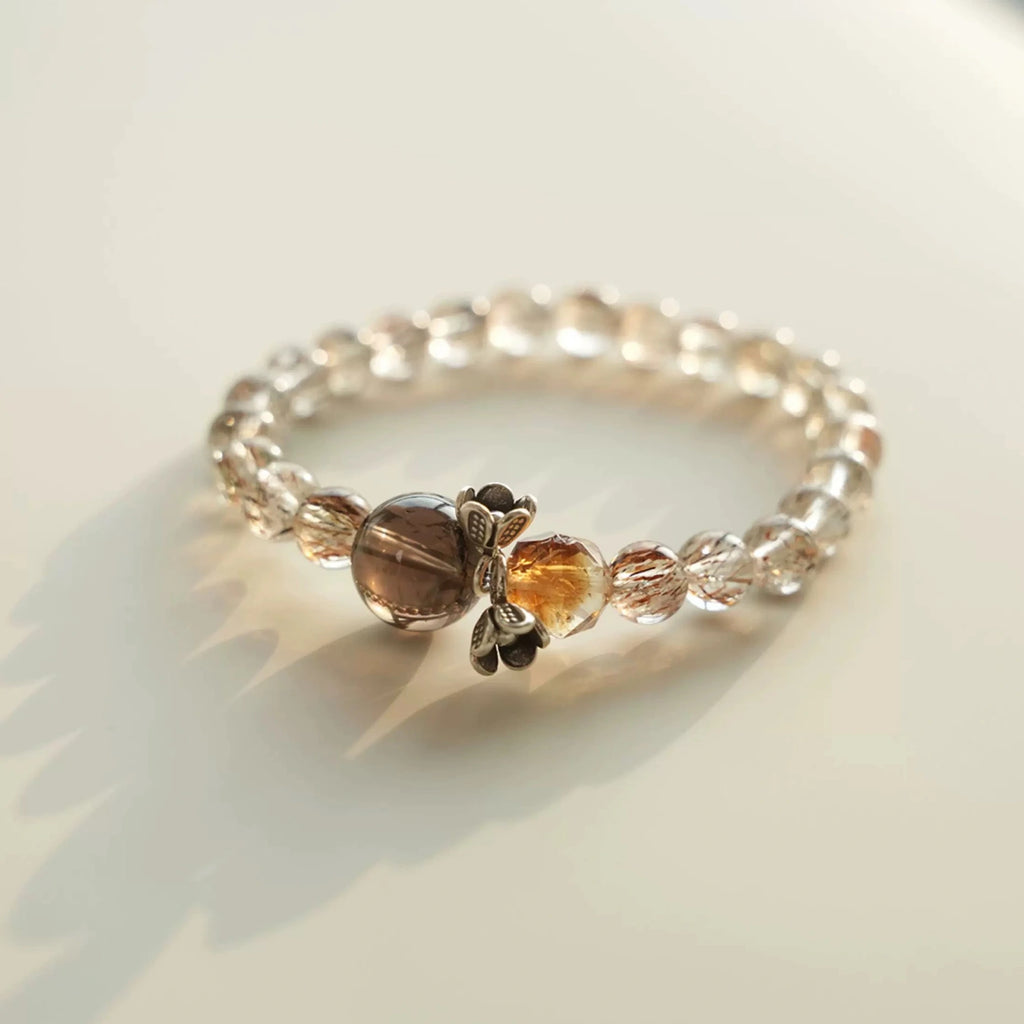 Multi-toned crystal bracelet blending bright citrine with copper rutile quartz textures.