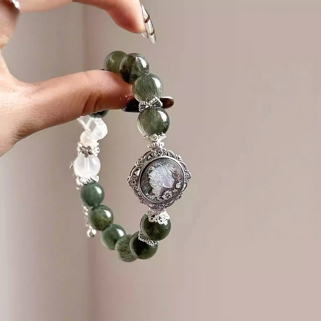 Green crystal bracelet featuring polished green quartz beads, handcrafted natural crystal jewelry.