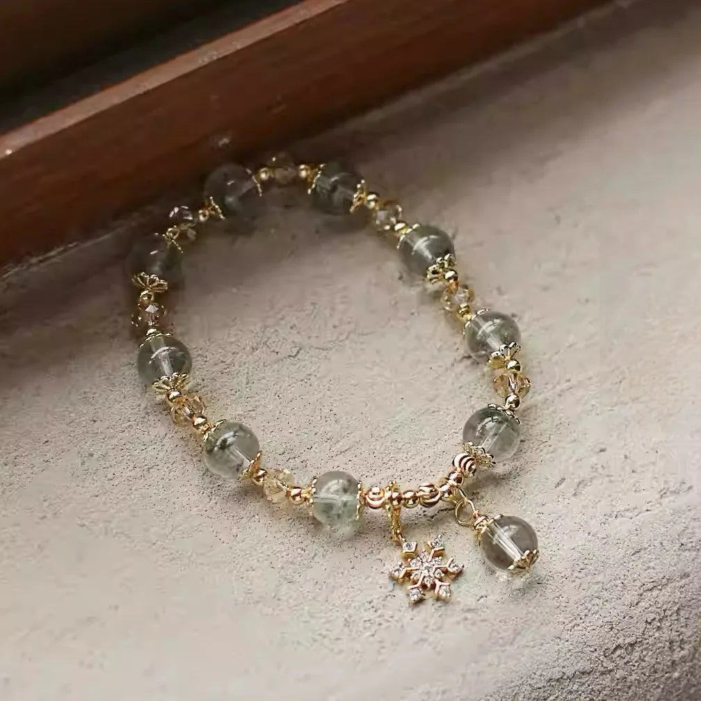 Green phantom quartz bracelet designed as a talisman for wealth, personal growth, and transformation.