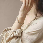 Model showcasing green phantom quartz bracelet, symbolizing abundance, personal growth, and transformative energy.