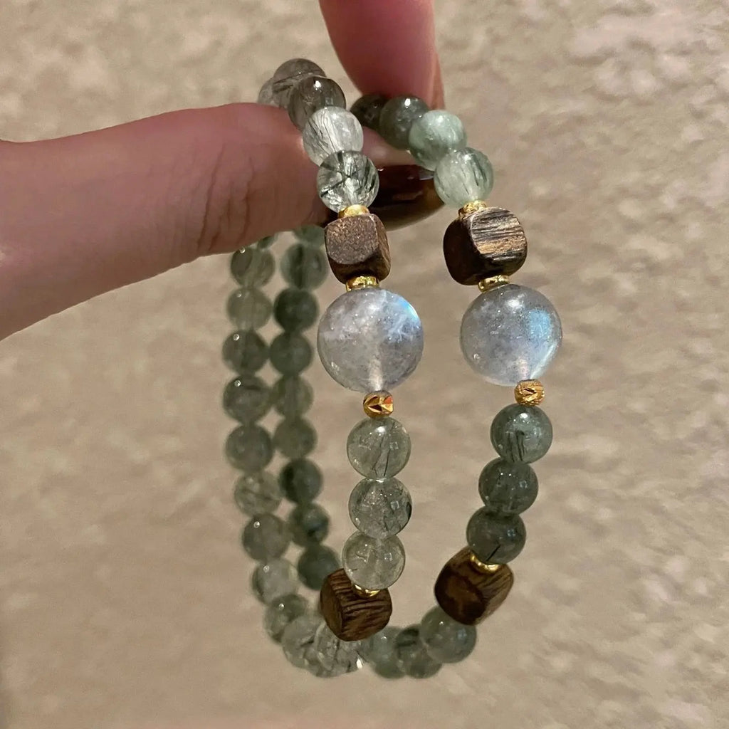 Green rutilated quartz bracelet with grey moonstone and agarwood for wealth, intuition, and grounding energy – natural healing crystal jewelry.