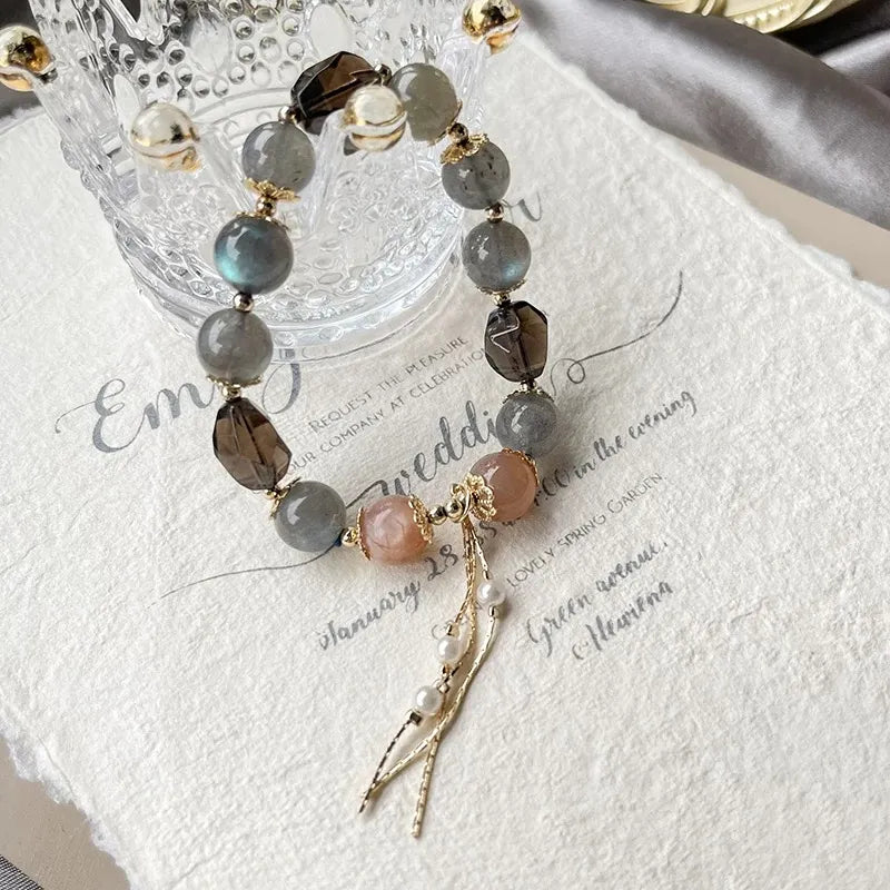 Grey and orange moonstone bracelet with smoky quartz for emotional balance, confidence, and grounding energy – natural healing crystal jewelry.