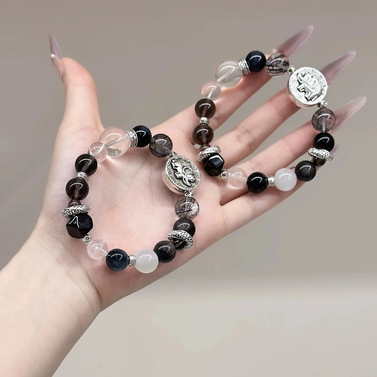 Handcrafted mixed black crystal bracelet featuring an elephant charm for balance, resilience, and spiritual protection.