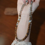 Elegant double-layer moonstone bracelet accented with agarwood beads, perfect for spiritual reflection and inner calm.