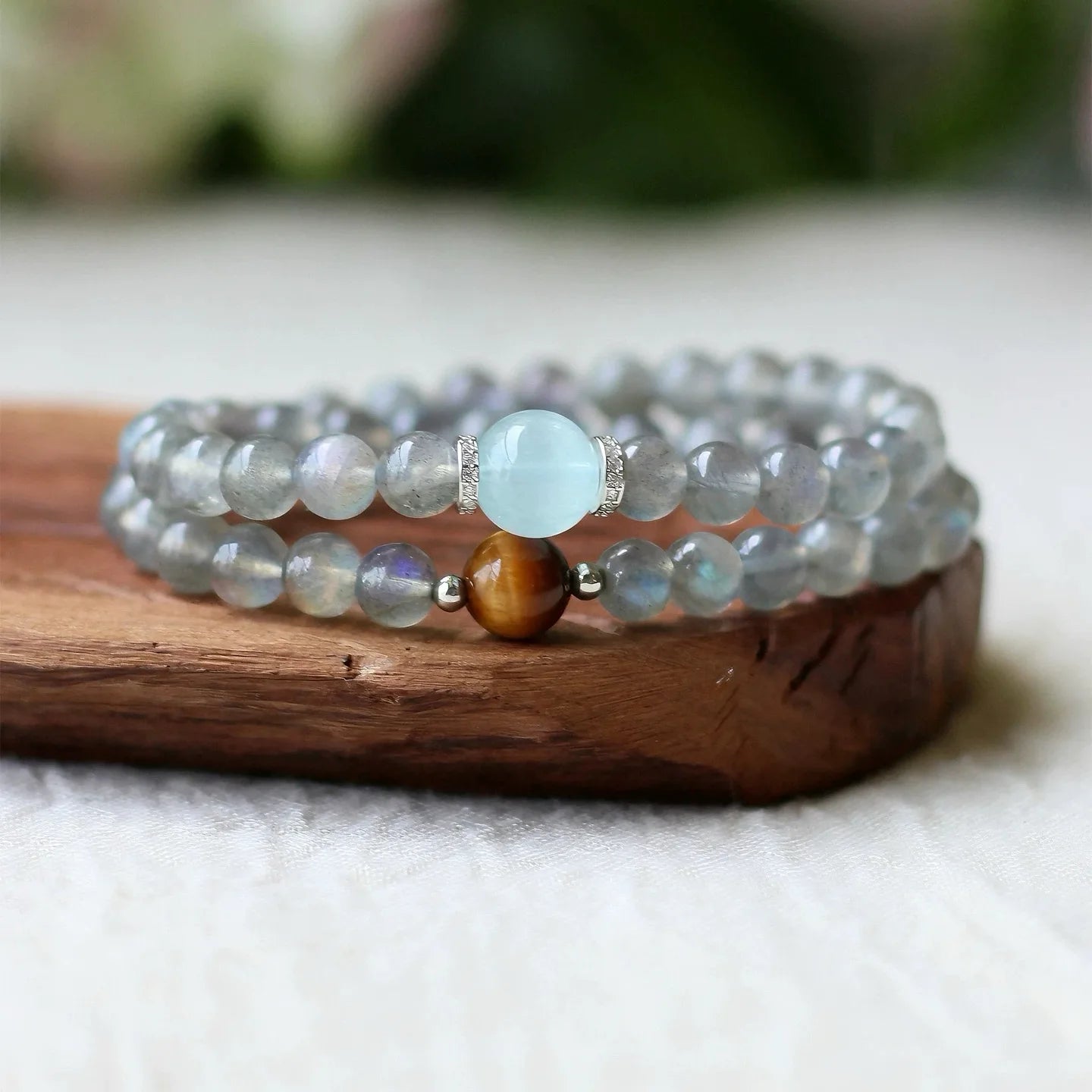 Moonstone bracelet with aquamarine accents, supporting inner peace, emotional balance, and heightened intuition.