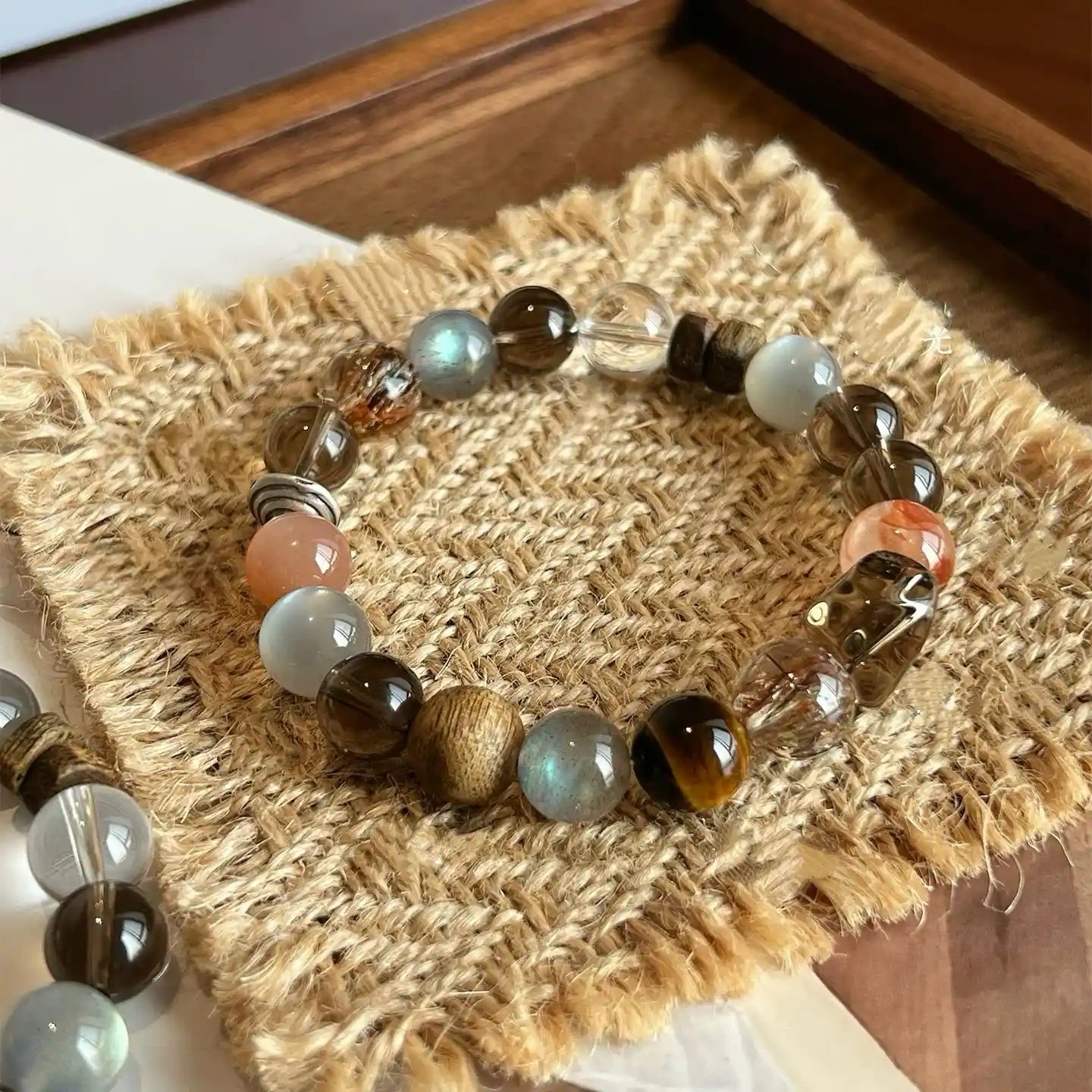 Natural stone bracelet combining multiple crystal colors in a balanced, harmonious layout.