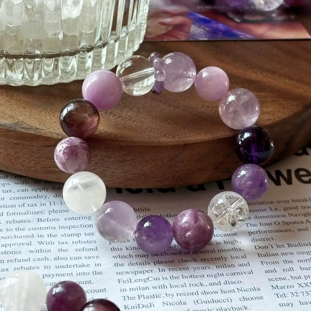 Close-up of multi-tone amethyst and clear quartz beads, enhancing intuition, calmness, and mindful energy.