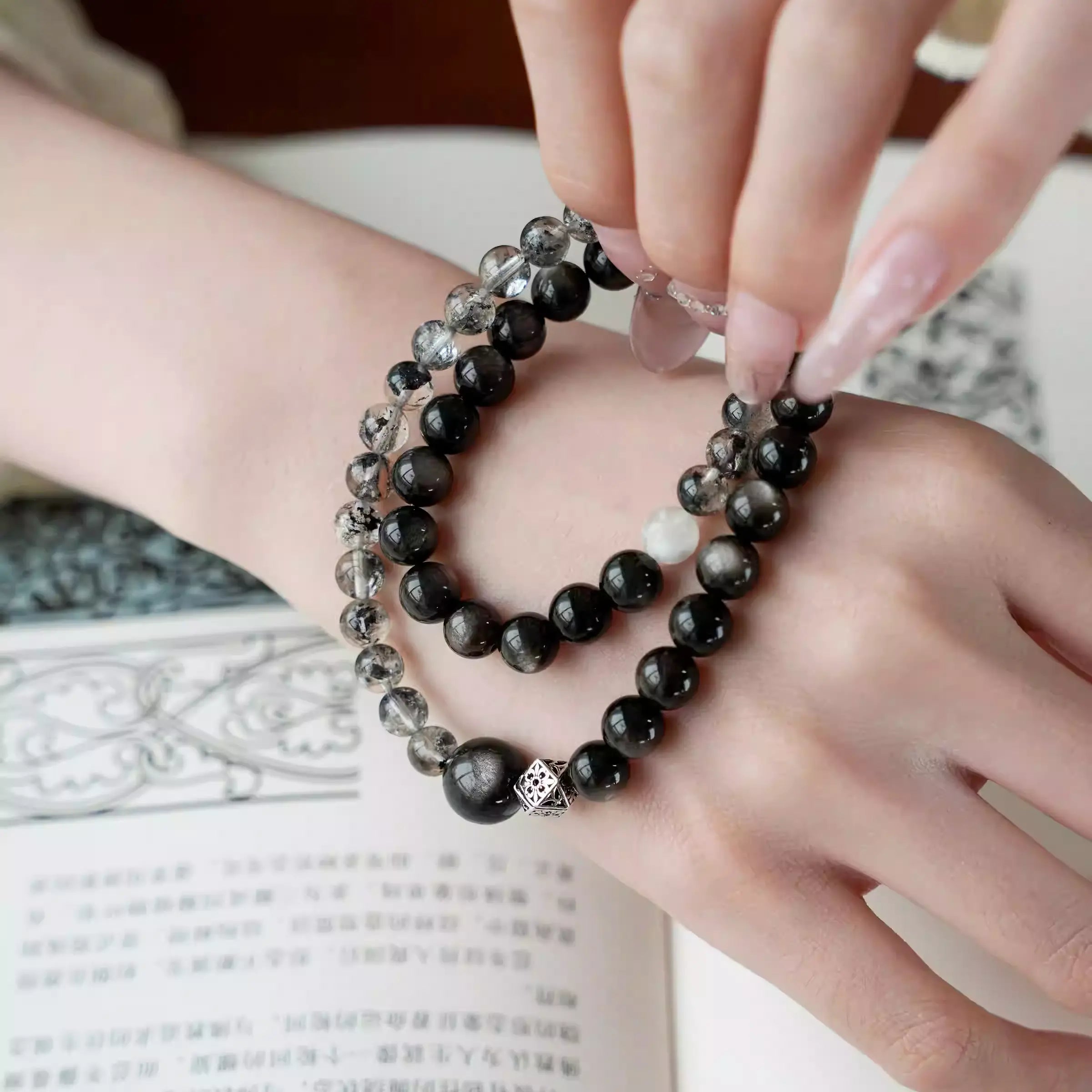 Double wrap bracelet made with natural silver obsidian beads, handcrafted crystal bracelet with glossy dark stones.