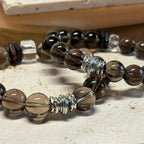 Smoky quartz bracelet, a crystal accessory for energy cleansing, stability, and inner power.