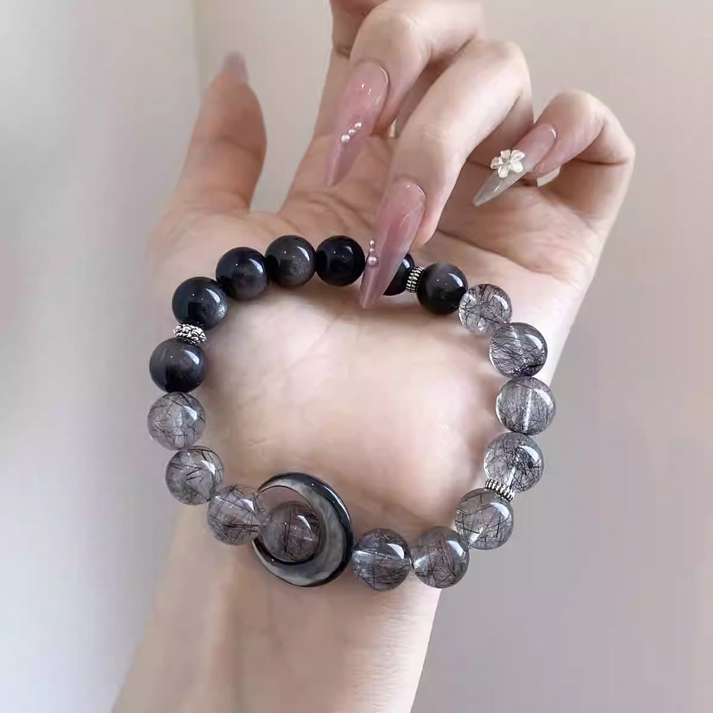 Grey crystal and obsidian gradient bracelet, layered natural crystal jewelry perfect for meditation and spiritual energy.