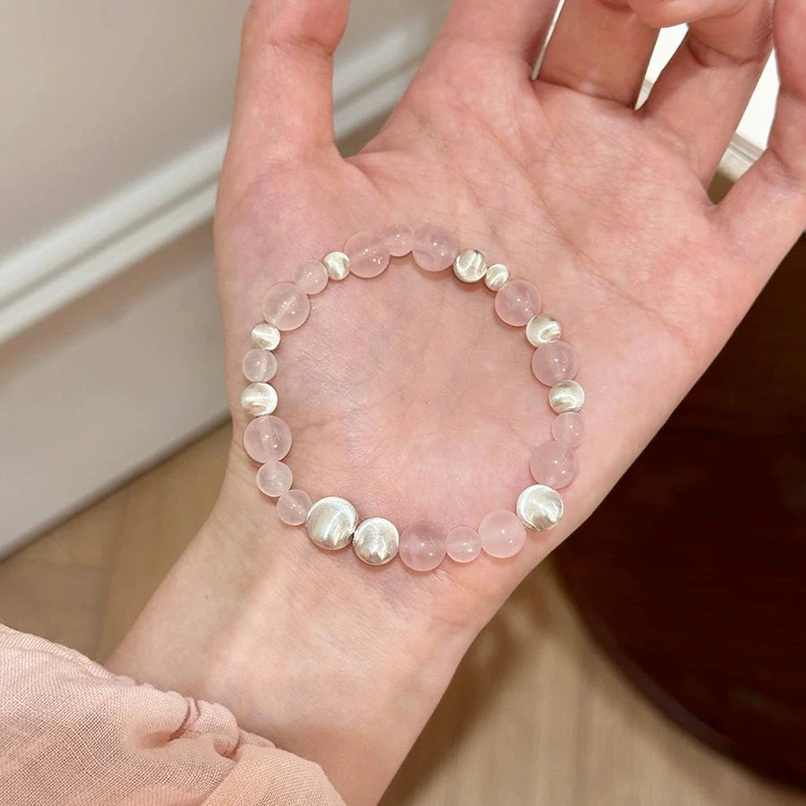 Elegant rose quartz and silver cat’s eye bead bracelet, promoting romance, positive energy, and inner calm – real crystal accessory.
