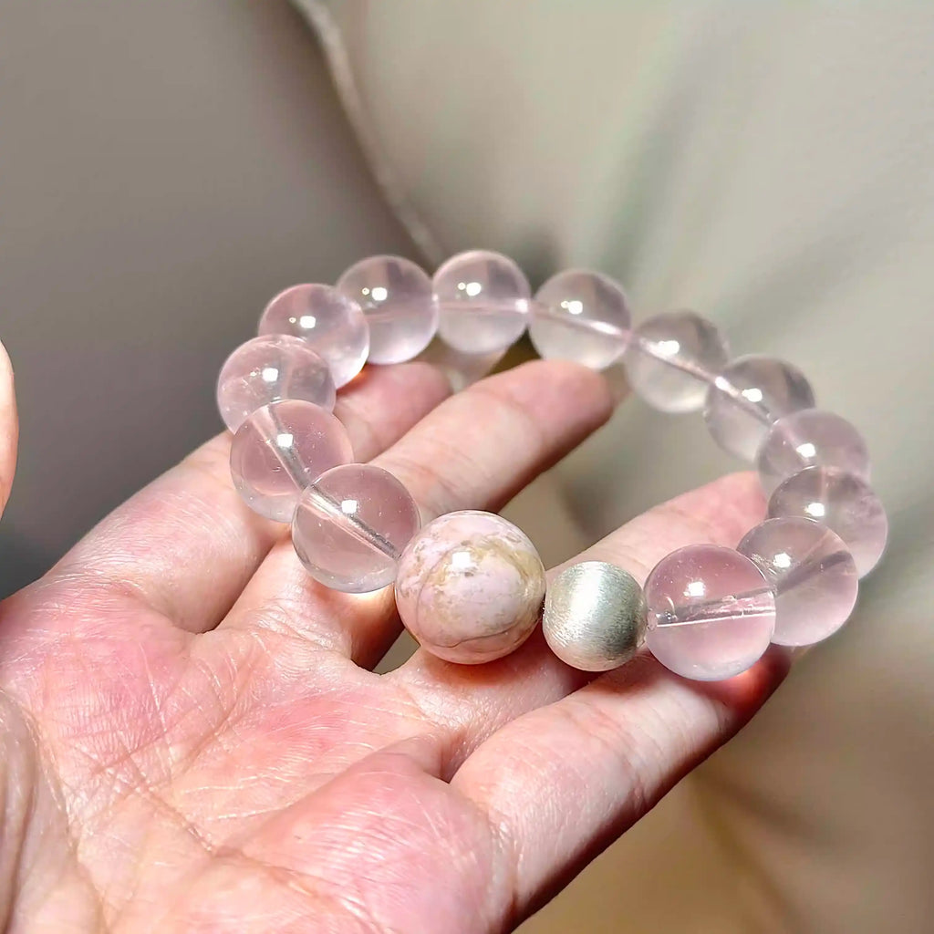 Handcrafted crystal bracelet made with light pink rose quartz beads.