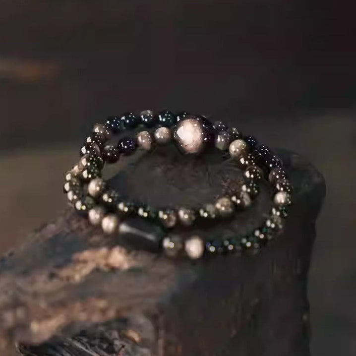 Double wrap black obsidian bracelet displayed to symbolize grounding, protection, and inner strength – elegant healing crystal accessory.