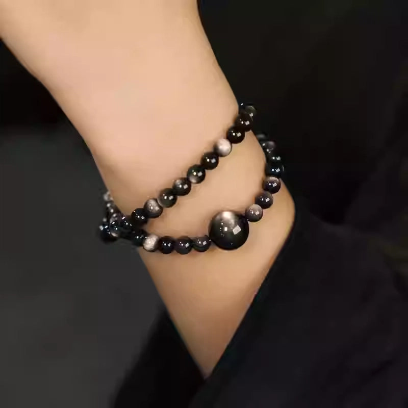Model showcasing vintage double wrap black obsidian bracelet, emphasizing shielding energy and calm confidence.